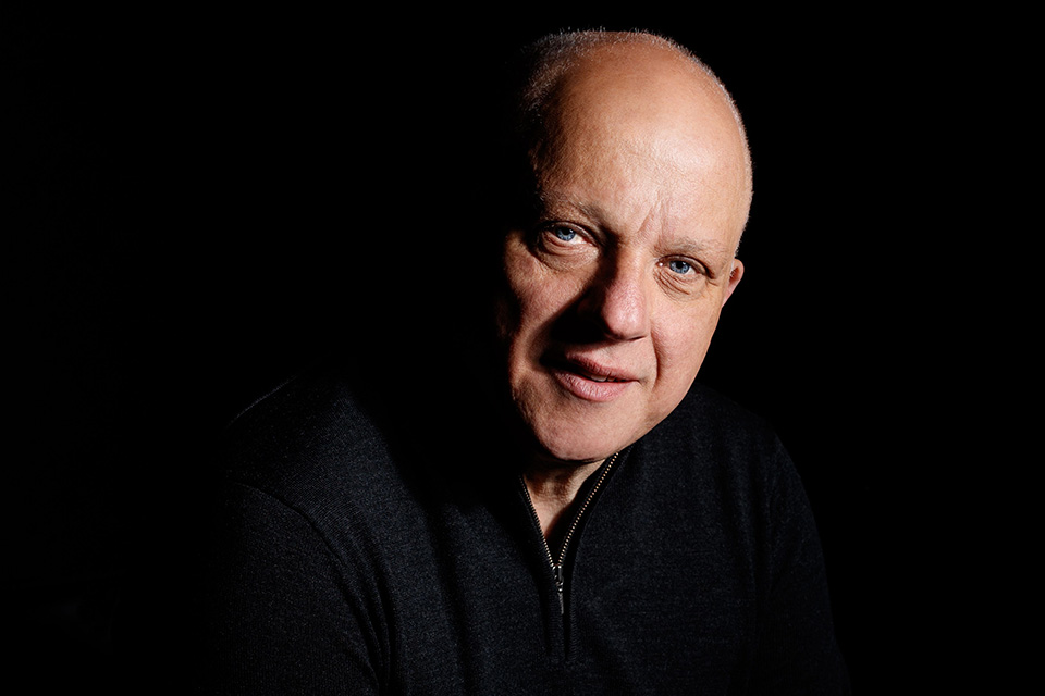 headshot of a man with a black backgroundtest